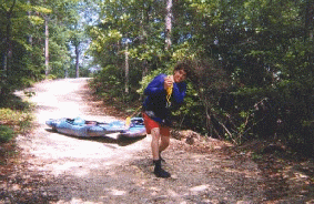 Whitney Peters on the 1/4 mile trek to Little River put-in