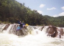 Debbie Meller boofing on Upper Ocoee